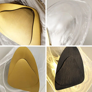 Four close-up shots of the Luxury Crystal Wall Lamp highlight abstract, triangular metallic and black shapes, each set against clear or illuminated textured backgrounds that evoke the lamp’s luxurious crystal design.