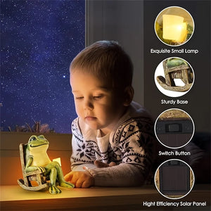 A young child looks at a Solar-powered Rocking Chair Frog Light figurine holding a small lamp, with labeled callouts showing features: small lamp, sturdy base, switch button, and high efficiency solar panel. This charming garden frog ornament is crafted from weatherproof resin for lasting outdoor enjoyment.