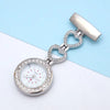 The Luxe Fob Pocket Watch features two rhinestone heart links and a round, crystal-accented, rhinestone-encrusted face, shown on a light blue and white background.