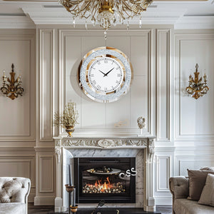 A classic living room with ornate wall paneling, a marble fireplace, gold sconces, a chandelier, and the Modern Luxury Roman Numerals Wall Clock displayed above the mantel.