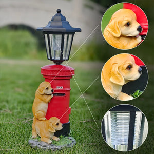 Two Solar Dog Lights stand by a red Victorian-style post lantern on grass, with close-up insets showing a dog’s face and the vintage street lamp detail.