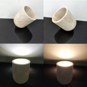 The Natural Stone Lamp—a cylindrical yellow cave stone light fixture—is displayed from side and top perspectives, illustrating its minimalist design and warm white glow. As a sculptural table lamp, it emphasizes the beauty of natural stone while seamlessly merging form with function.