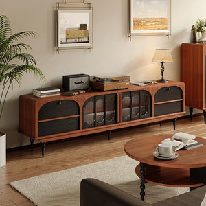 An Antique TV Cabinet Combo Set sits against a living room wall, displaying records, books, and decor. Framed art hangs above, with a lamp on one end for a stylish mid-century modern touch.