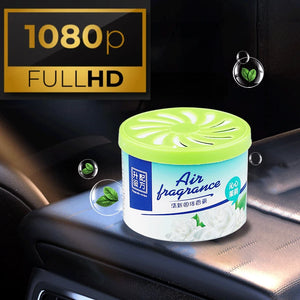 A container of Fake Decorative Display SpyCam with a green lid is placed inside a car, subtly doubling as a high-tech surveillance tool. The image also includes a "1080p FULL HD" label in the top left corner.