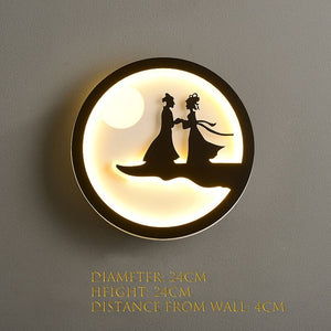 The Minimalist Wall Lamp showcases silhouettes of two people holding hands beneath a luminous circle reminiscent of the moon. Perfect for a contemporary home, it provides a gentle and inviting glow. Its dimensions include a diameter and height of 24cm each, with a distance from the wall measuring 4cm.