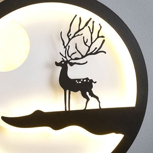 Minimalist Wall Lamp featuring a silhouette of a deer with branching antlers on a softly glowing circular background, ideal for a modern home.
