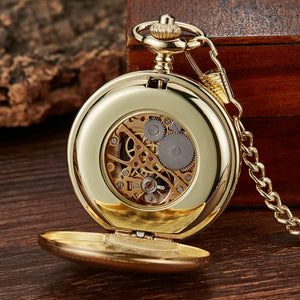 The Vintage Mechanical Pocket Watch features an open gold case showing visible gears and intricate inner mechanisms, displayed on a wooden surface beside a wooden box.