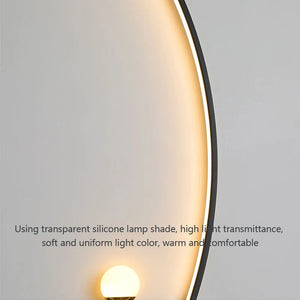 The Arc Wall Sconce, featuring a transparent silicone lampshade, emits a warm and uniform light. This modern wall light boasts high light transmittance and exceptional comfort, making it an elegant lighting solution for any room.