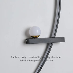 A stylish and modern lighting choice, the Arc Wall Sconce showcases a spherical white bulb elegantly mounted on a minimalist black metal bracket against a light gray wall. Below the sconce, text reads, "The lamp body is made of high-quality aluminum, which is rust-proof and durable.