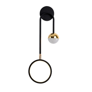 The Hanging Circle Wall Light offers a stylish Nordic design with a modern black circular frame and a glowing center, accentuated by geometric forms and a spherical gold detail.