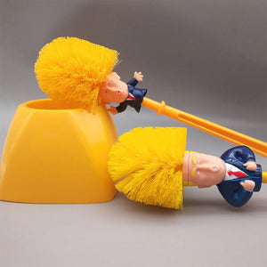 Two Trump Tidy Toilet Brushes, each with handles shaped like a suited figure with yellow hair, stand beside a matching yellow holder on a gray surface—a funny and unique bathroom accessory.