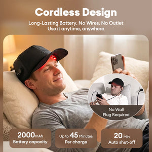 Cordless heated cap for hair growth with 2000mAh rechargeable battery worn on a sofa, no wall plug or wires required for red light therapy.