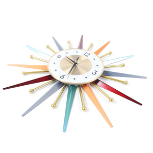 The Sunburst Wall Clock features a gold face, vibrant spikes with gold spheres, black hour and minute hands, and a white ring with black numerals—an eye-catching piece that adds atomic age charm to any space.