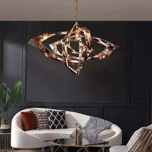 Modern living room with the Elegant Industrial Gallery Pendant light fixture above a white curved sofa, patterned pillows, and a potted plant set against a dark paneled wall.