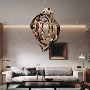 Modern living room with a gray sofa, wooden coffee table, Elegant Industrial Gallery Pendant light fixture, wall art, and neutral-toned decor.