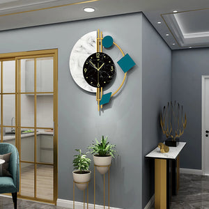 A modern living room features the Modernist Constellation Accent Clock with geometric shapes, potted plants on stands, and a console table with abstract decor against gray walls.