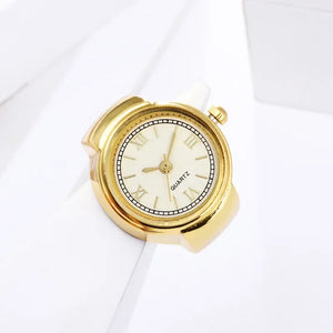 The Eternal Ring Watch is a gold analog quartz minimalist timepiece featuring a white face with gold hour markers, shown against a white background.