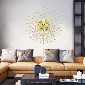 Modern living room with a tan sectional sofa, gray cushions, coffee table, and the Lux Radiance Starburst Wall Clock above the couch serving as a bold statement timepiece.
