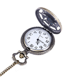 The Skeleton Pocket Watch features an ornate bronze case and chain, opening to reveal a white dial with black Arabic numerals and decorative hour and minute hands.