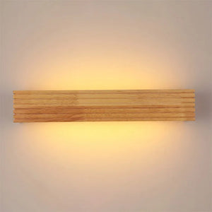 The Rectangle Wooden Wall Light showcases a rectangular design that emits a warm glow, elegantly combining Scandinavian style with natural materials.