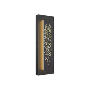 A rectangular black wall light fixture with a vertical line of illumination on the left and a decorative pattern of circular holes on the right, creating a striking focal point.