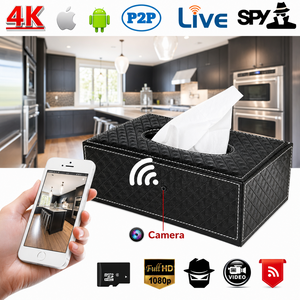 A black SpyCam Tissue Box, cleverly designed as a tissue box cover with a hidden camera, streams 4K video directly to your smartphone. Displayed in a modern kitchen, feature icons highlight live view, high-resolution streaming, and broad compatibility—making it the perfect discreet surveillance solution for any space.