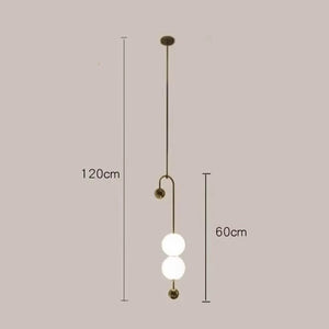Discover the artistic charm of the Minimalist Line Light, featuring dual white globes on a sleek brass rod. With a total height of 120 cm and a 60 cm section for the globes, it elegantly enhances any space.