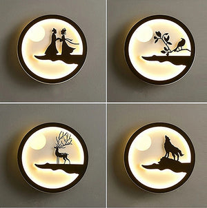 A set of four Minimalist Wall Lamps casts a soft and warm glow, highlighting silhouettes such as a couple, a bird on a branch, a deer with large antlers, and a howling wolf. Perfect for the modern home, these lamps add both elegance and ambiance to any space.