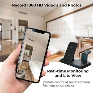 A hand holds a smartphone showing a room, while the Universal Charging Station SpyCam with dual lenses is nearby. Text highlights features: "Record 1080 HD Video and Photos" and "Real-time Monitoring and Lite View," ideal for covert surveillance.