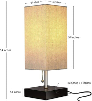 The Desk Lamp Charging SpyCam is a rectangular lamp with a beige shade, standing 14 inches tall and 5 inches wide. Its sleek black base includes a pull chain and USB port, inspired by James Bond design aesthetics.
