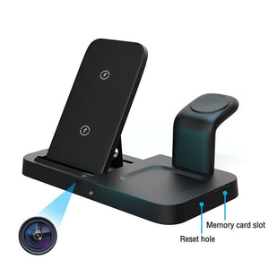 The Universal Charging Station SpyCam is a sleek black smart hub with multiple slots, including a smartphone stand and watch holder. It features a reset hole, memory card slot, and labeled directional lines, enhancing its function as both a charger and organized tech station.