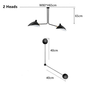 The Sleek Industrial Pendant Light is a black two-headed ceiling fixture with brass connection points, measuring 80 cm in width, 65 cm in height, and featuring two 40 cm arms.