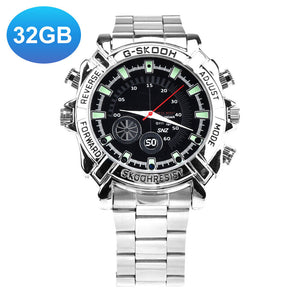 The Watch SpyCam is a silver wristwatch with a black dial, labeled function buttons, and “32GB” marking. It features a 1080P camera for discreet video and audio recording—ideal for stylishly capturing moments anytime.