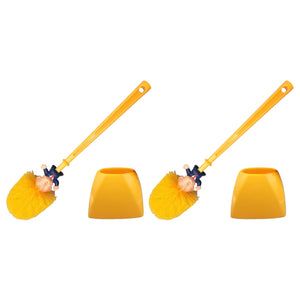 Two Trump Tidy Toilet Brushes with handles shaped like a Trump caricature and yellow holders are displayed against a white background, adding a humorous twist as a fun novelty bathroom accessory.