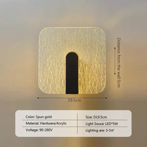 Introducing the Beautiful Wall Sconce: a square-shaped, gold-colored wall light crafted from hardware and acrylic. This minimalist design measures 19.5 cm across and requires a 5W LED light source. It is perfect for illuminating an area of 3-5 square meters, adding a touch of modern luxury to any space.