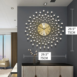 The Lux Radiance Starburst Wall Clock, gold and silver with a 29.5-inch (75 cm) diameter, is showcased on a dark gray wall above a cabinet in a modern living room, creating a striking statement piece.