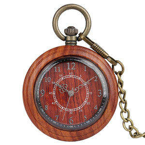The Wooden Pocket Watch from the vintage collection shows 10:08, with Arabic numerals and ornate hands on a round wooden face, paired with a metal chain.