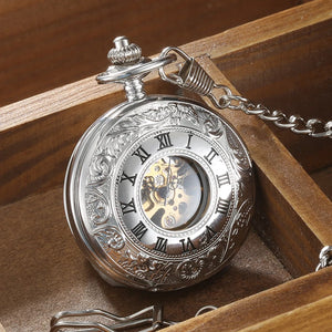 The Vintage Mechanical Pocket Watch features Roman numerals, ornate engravings, and a visible mechanical movement. It comes with a metal chain and is presented in a wooden box.