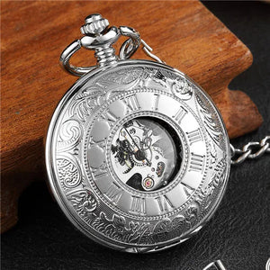 The Vintage Mechanical Pocket Watch displays Roman numerals and elegant engravings, with part of its internal mechanism visible through a small glass window.