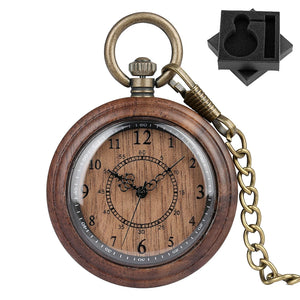The Wooden Pocket Watch features a brass chain, ornate clock hands, and Arabic numerals, displayed beside a black foam insert with a custom cutout—an elegant choice for any collection.