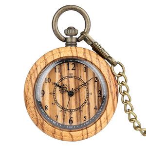 The Wooden Pocket Watch features a round wood case, black numerals, ornate clock hands, and a metal chain attached to the top.