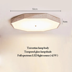Natural Stone Ceiling Light features an octagonal design with a refined body crafted from natural travertine, complemented by a tempered glass shade and an energy-efficient 42W full spectrum LED. Measuring 50cm wide and 6cm high, this wabi-sabi fixture blends organic materials with understated elegance.