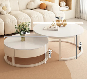 The Luxury Round Coffee Table Set features two white minimalist tables: one with a marble-look top measuring 70cm wide and 45cm tall, and the other 50cm wide and 38cm tall.