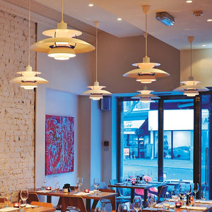 A restaurant with minimalist style and functional tables and chairs.
