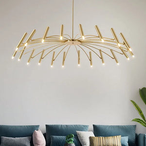 A contemporary living room with a blue couch and a gold chandelier that exudes elegance and utilizes space efficiently.