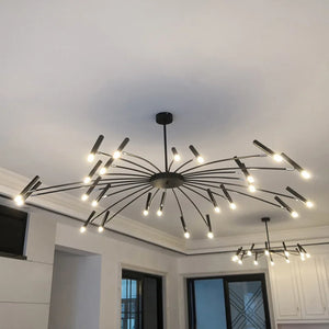An adjustable contemporary candle style chandelier that exudes elegance with its abundance of lights hanging from it.