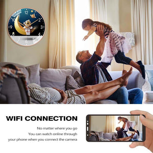 A man playfully lifts a child in a living room, and an Astronaut Moon Clock SpyCam adorns the wall. In the foreground, a phone showcases its live stream via WiFi connection.