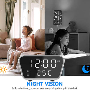 An advertisement demonstrating the discreet monitoring and night vision feature of a digital Clock Charger SpyCam, showing a child visible in both daylight and darkness.