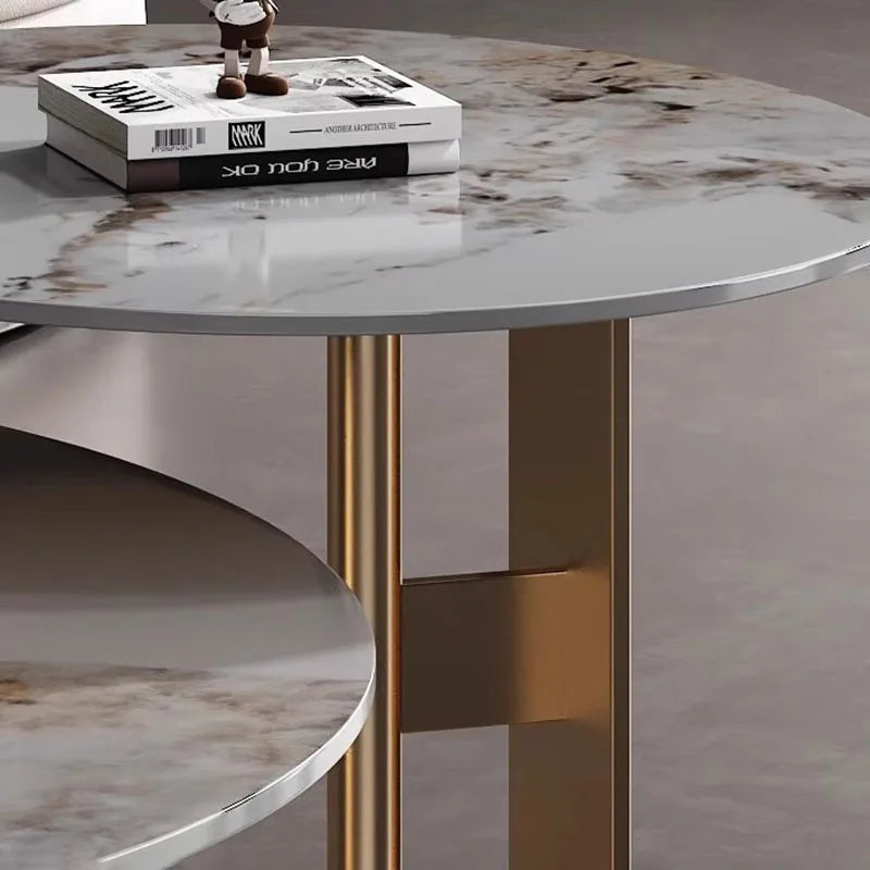 Two Premium Round Coffee Tables with marble tops and gold legs add elegance; one holds stacked magazines and a small brown clock.