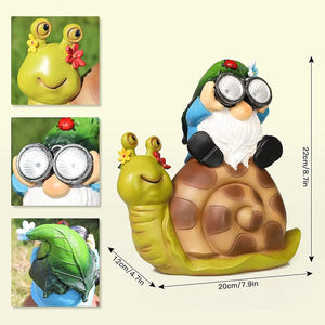 Add a touch of whimsy to your outdoor decor with the Solar Gnome Snail Light, featuring a garden gnome with large glasses riding atop a cheerful snail. Detailed insets display close-ups of the gnome, the snail’s expressive face, and the colorful hat. Measuring 22cm x 20cm x 12cm, this delightful piece doubles as a charming solar light to brighten up your garden at night with its magical glow.